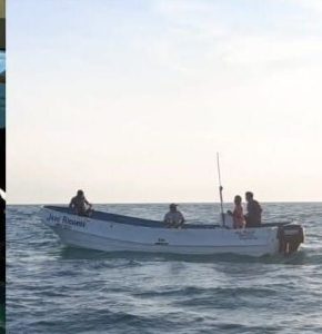 Embarcación averiada siendo remolcada a la orilla tras el operativo donde rescataron a cuatro pescadores en la costa yucateca.